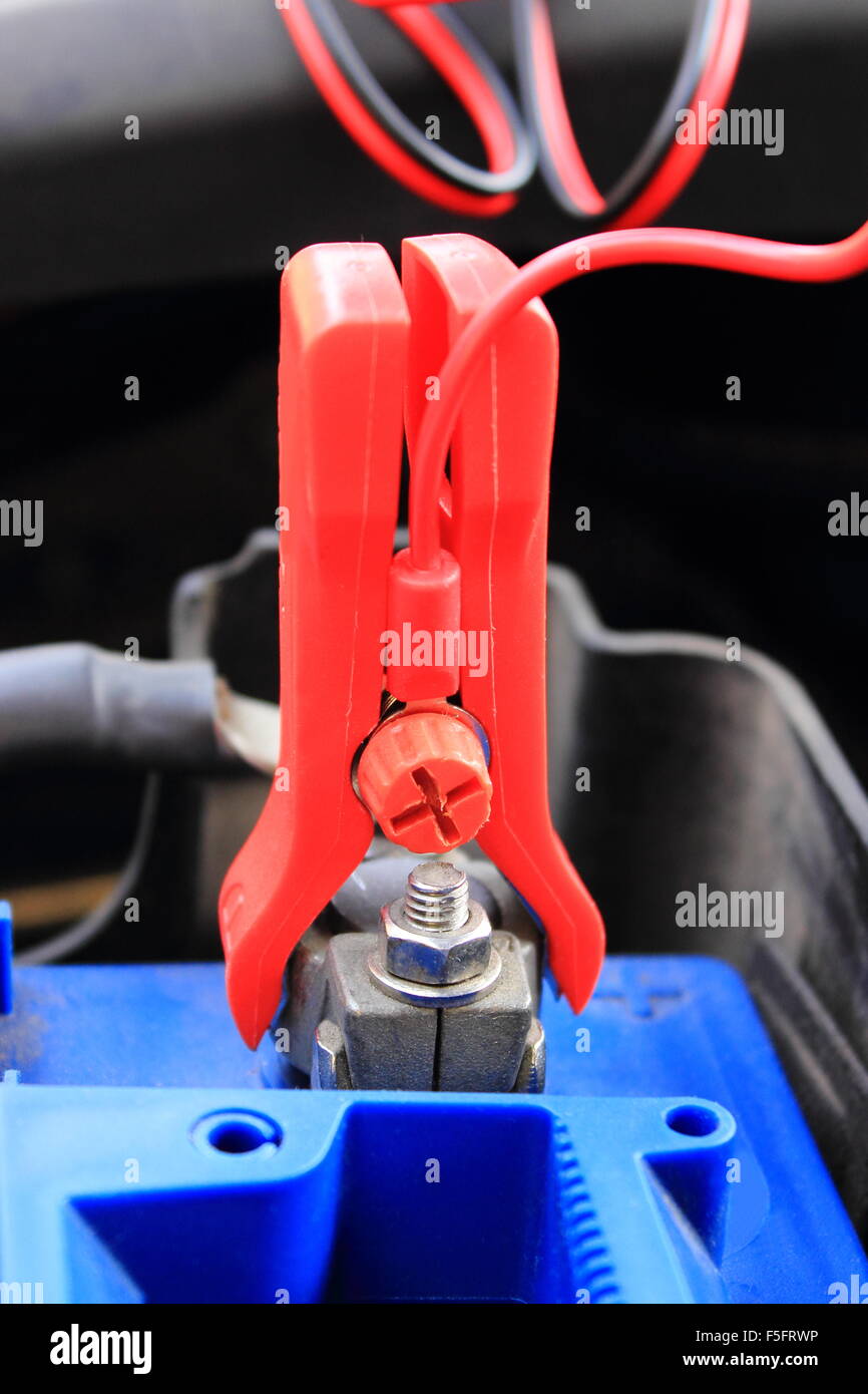 Charger with cables uses to charge old dead car battery Stock Photo Alamy