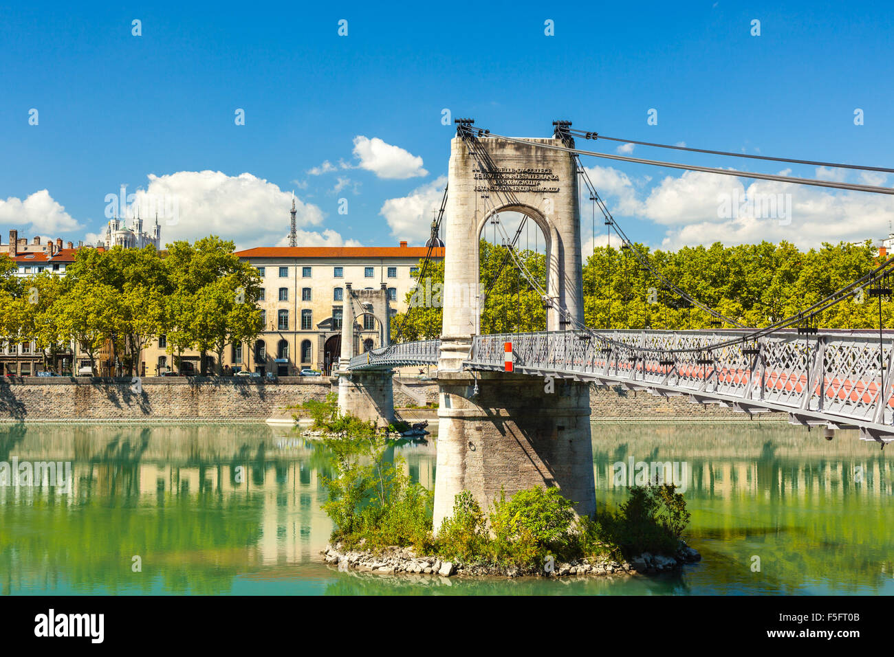 Old Passerelle du College bridge over Rhone river in Lyon, France. Summer day Stock Photo