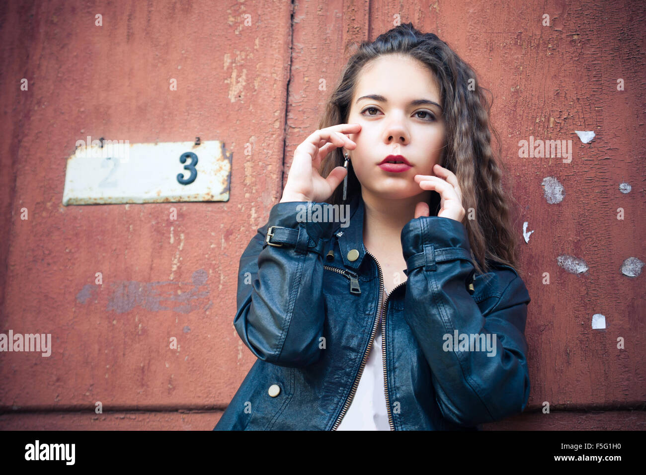 Young woman in leather jacket Stock Photo - Alamy