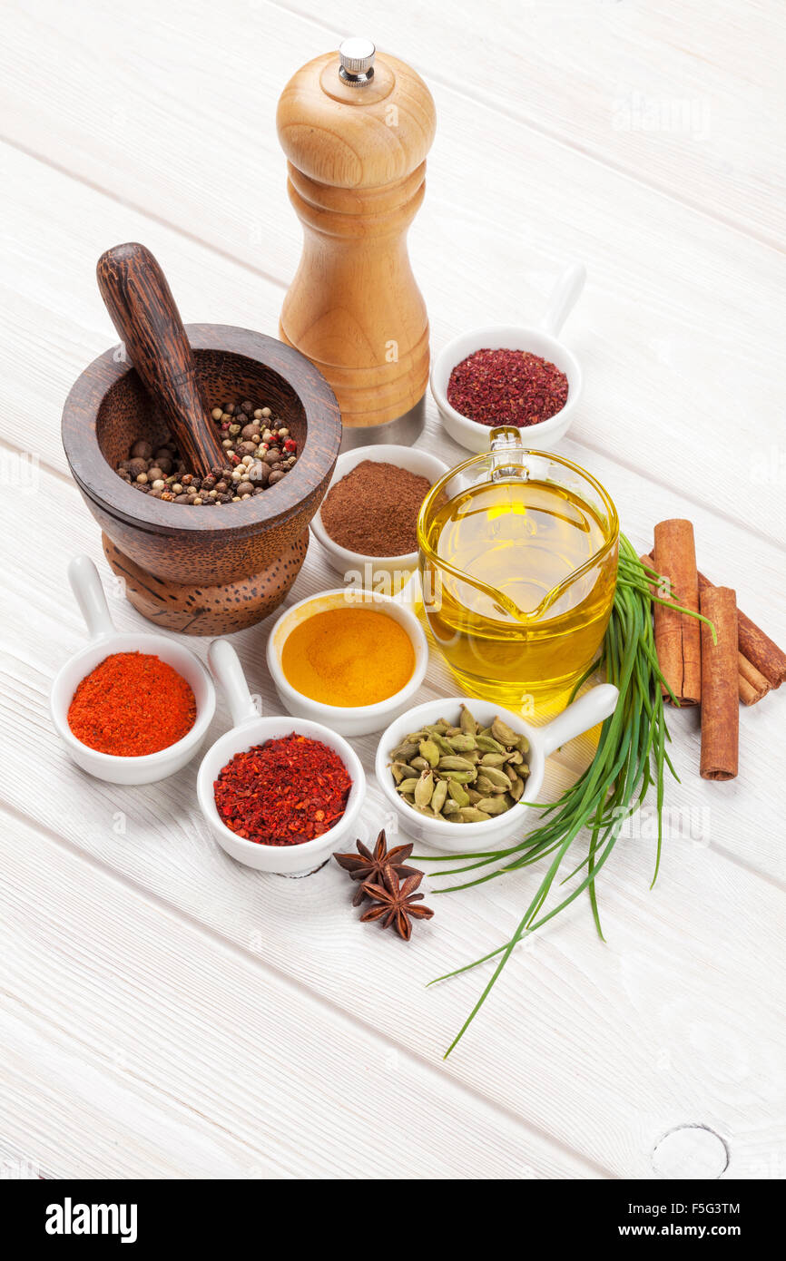 Various spices on white wooden background Stock Photo