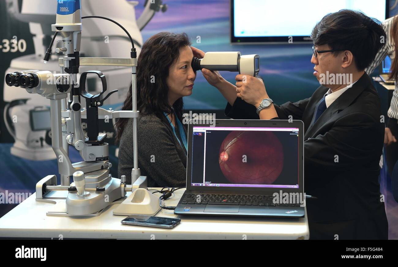 Hong Kong. 4th Nov, 2015. An exhibitor introduces their ophthalmic