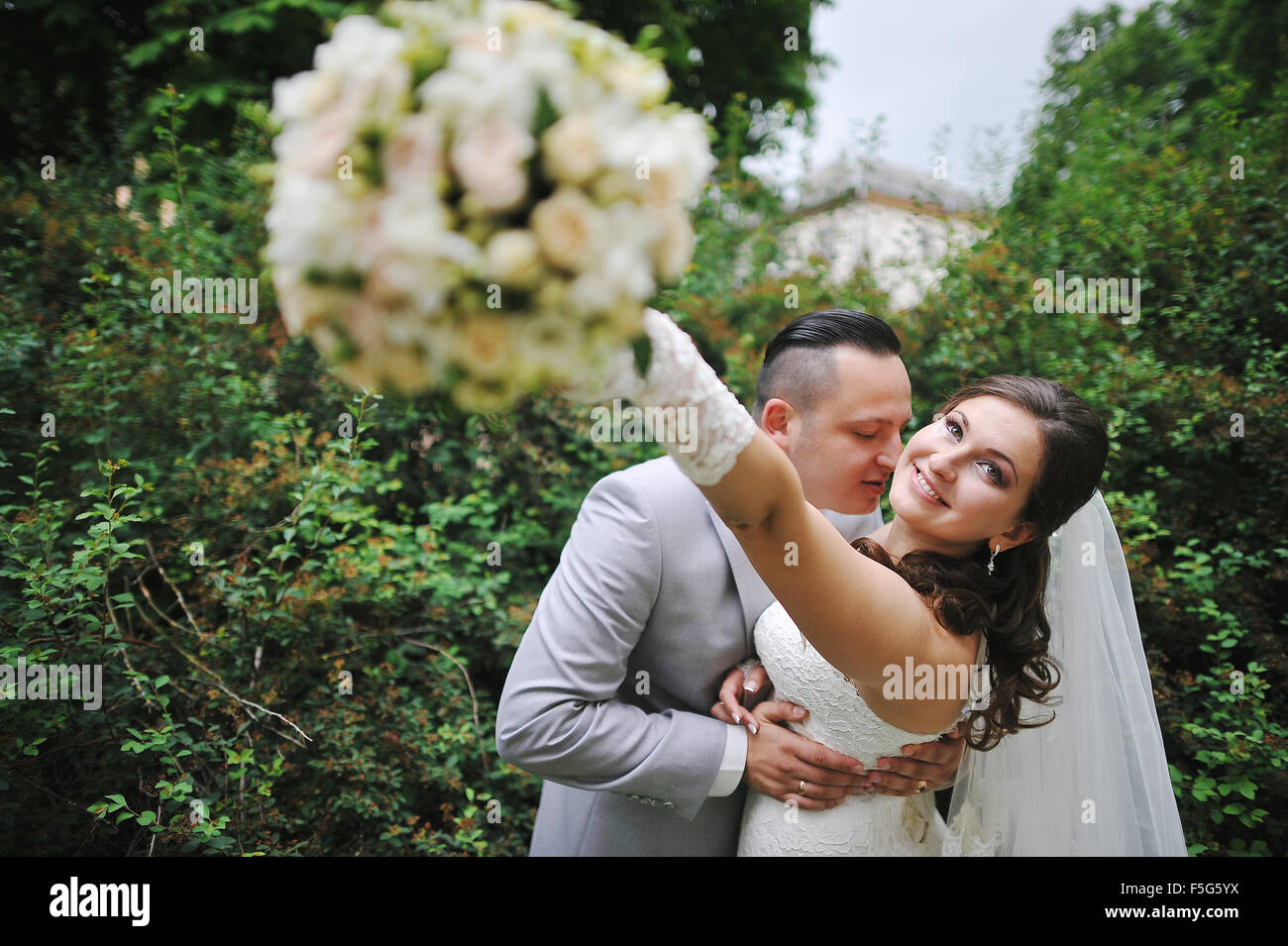 Wedding bouquet at hands of bride Stock Photo - Alamy