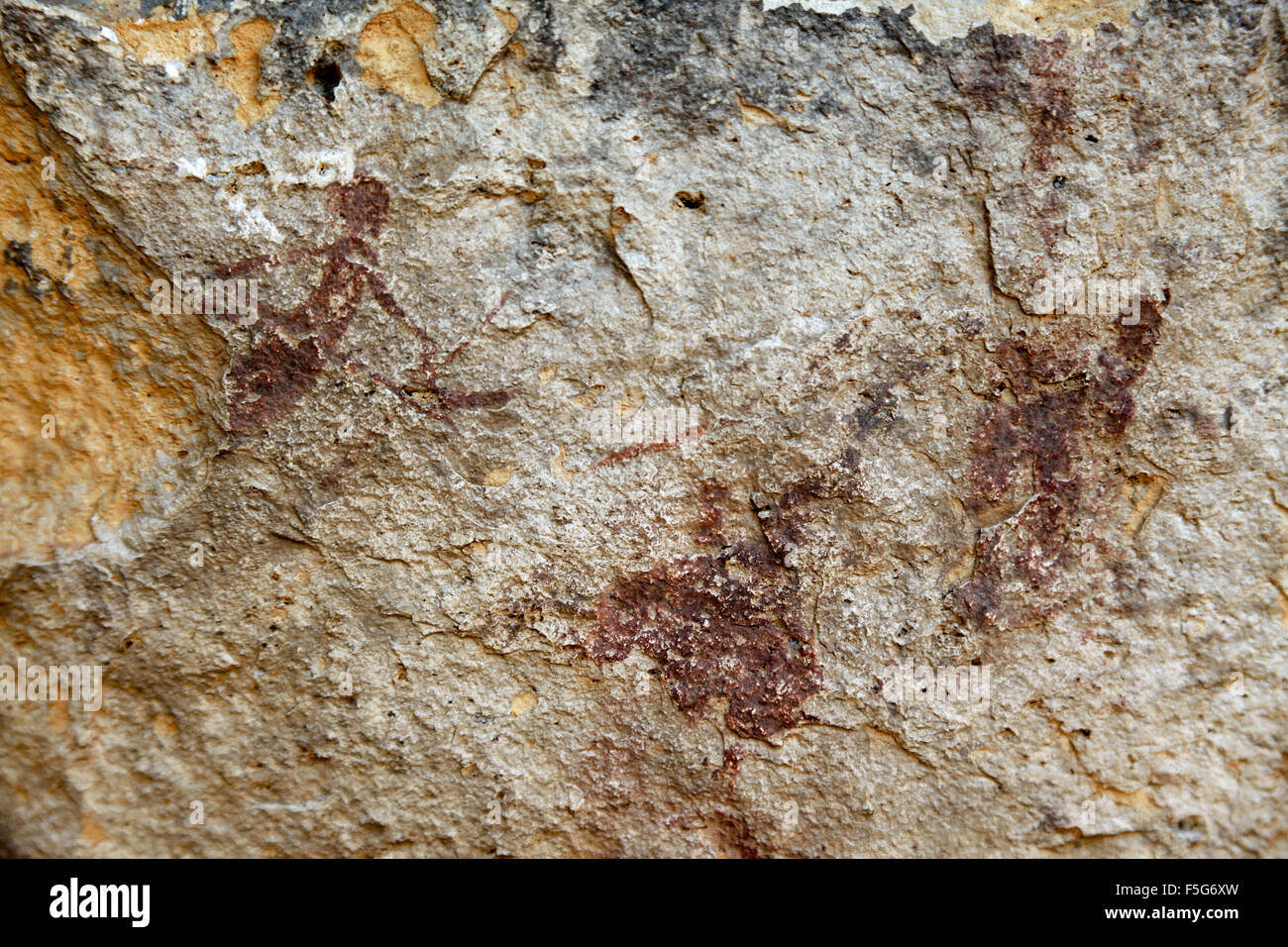 Prehistoric paintings in the cave Portell de les Lletres, near Montblanc, Tarragona, Catalonia, Spain. UNESCO World heritage sit Stock Photo
