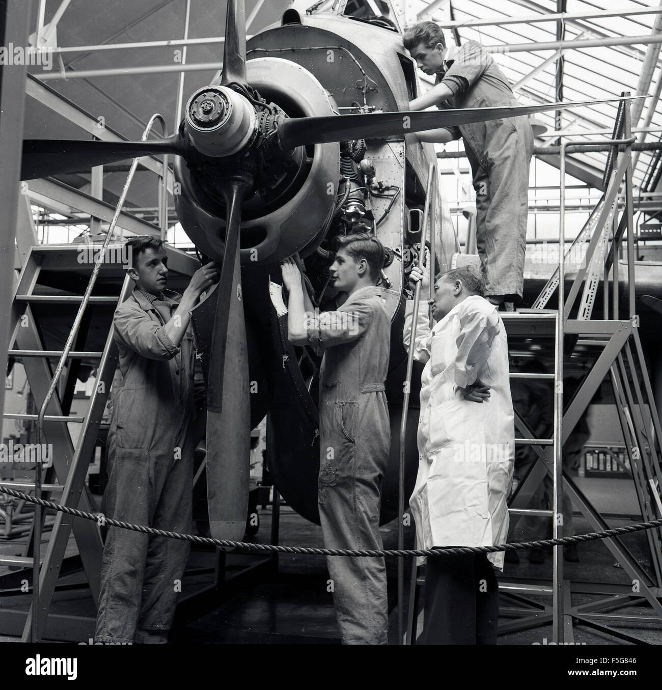Historical, 1950s, aviation engineering apprentices or students working