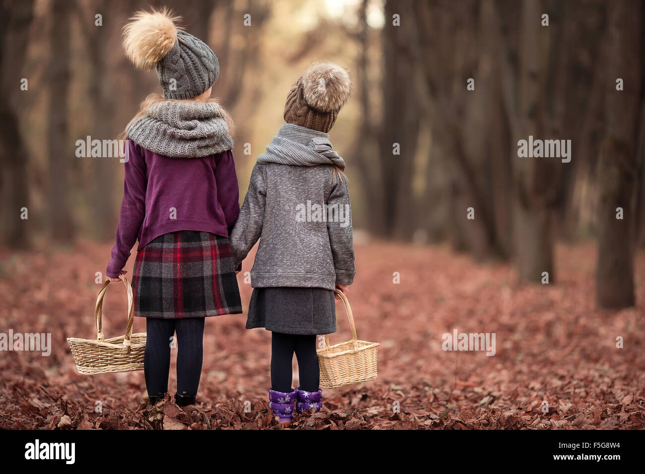 Little adorable girls at warm sunny autumn day outdoors Stock Photo - Alamy