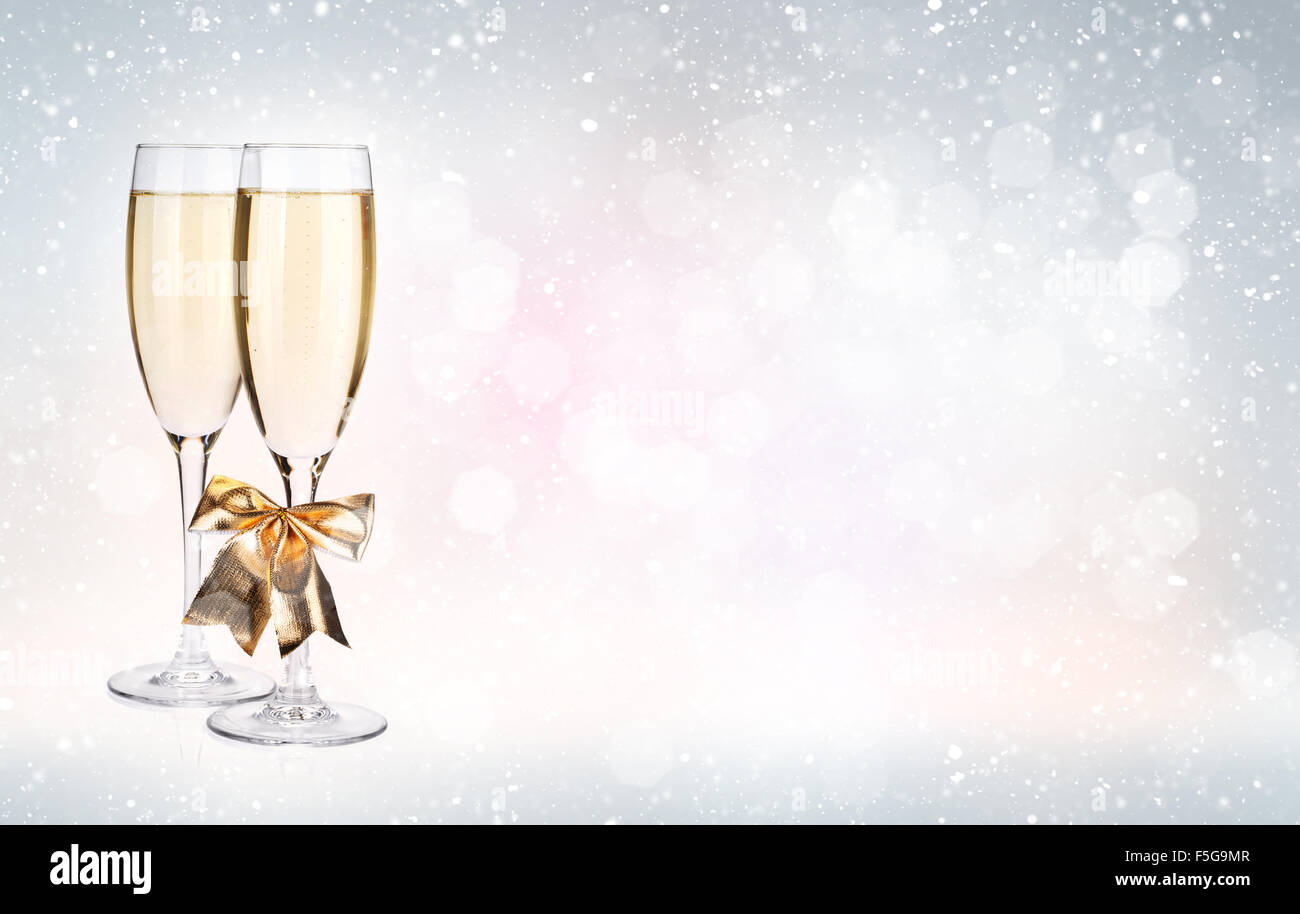 Two champagne glasses over christmas background with copy space Stock