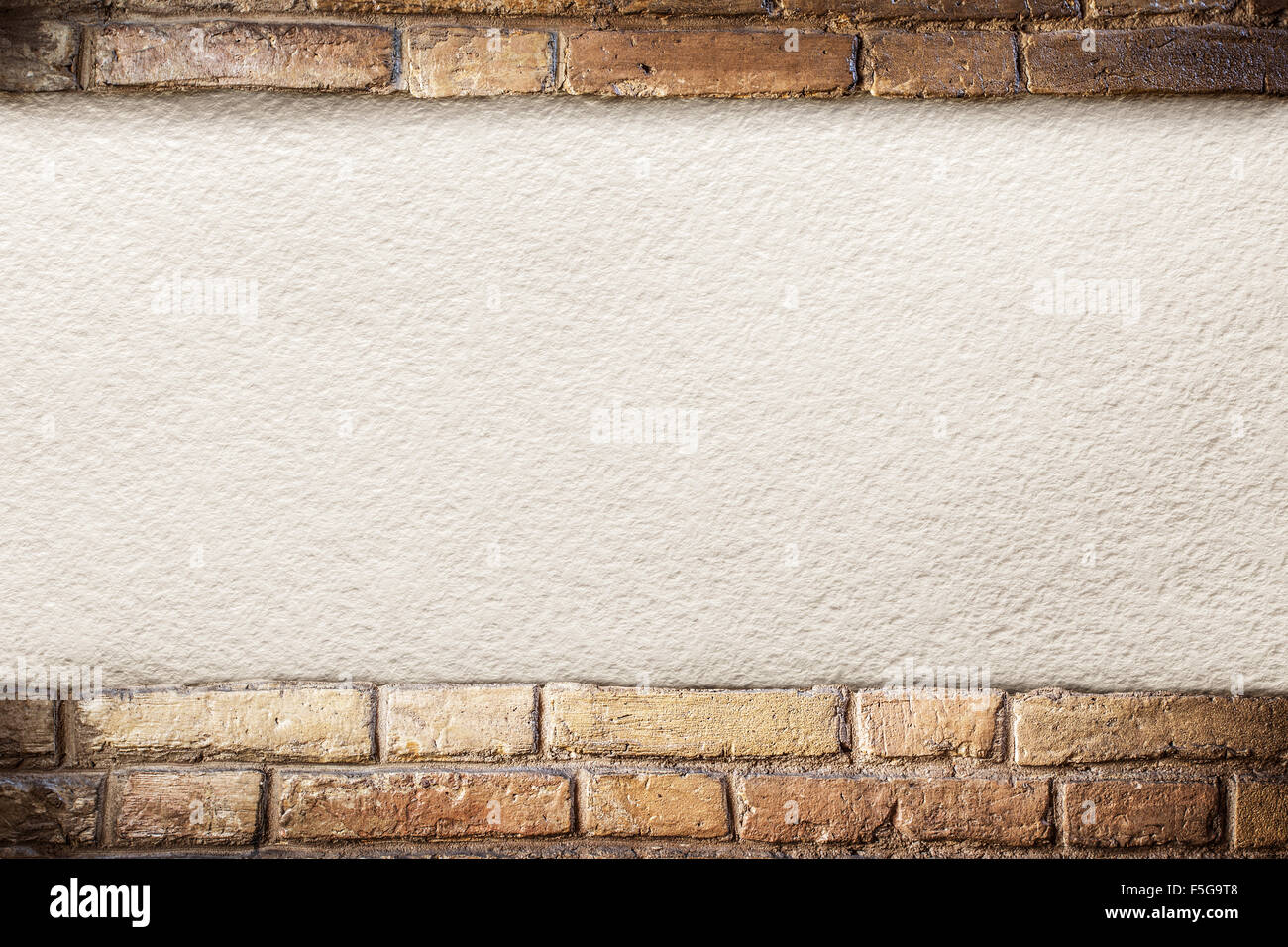 Old paper on aged brick wall. Stock Photo