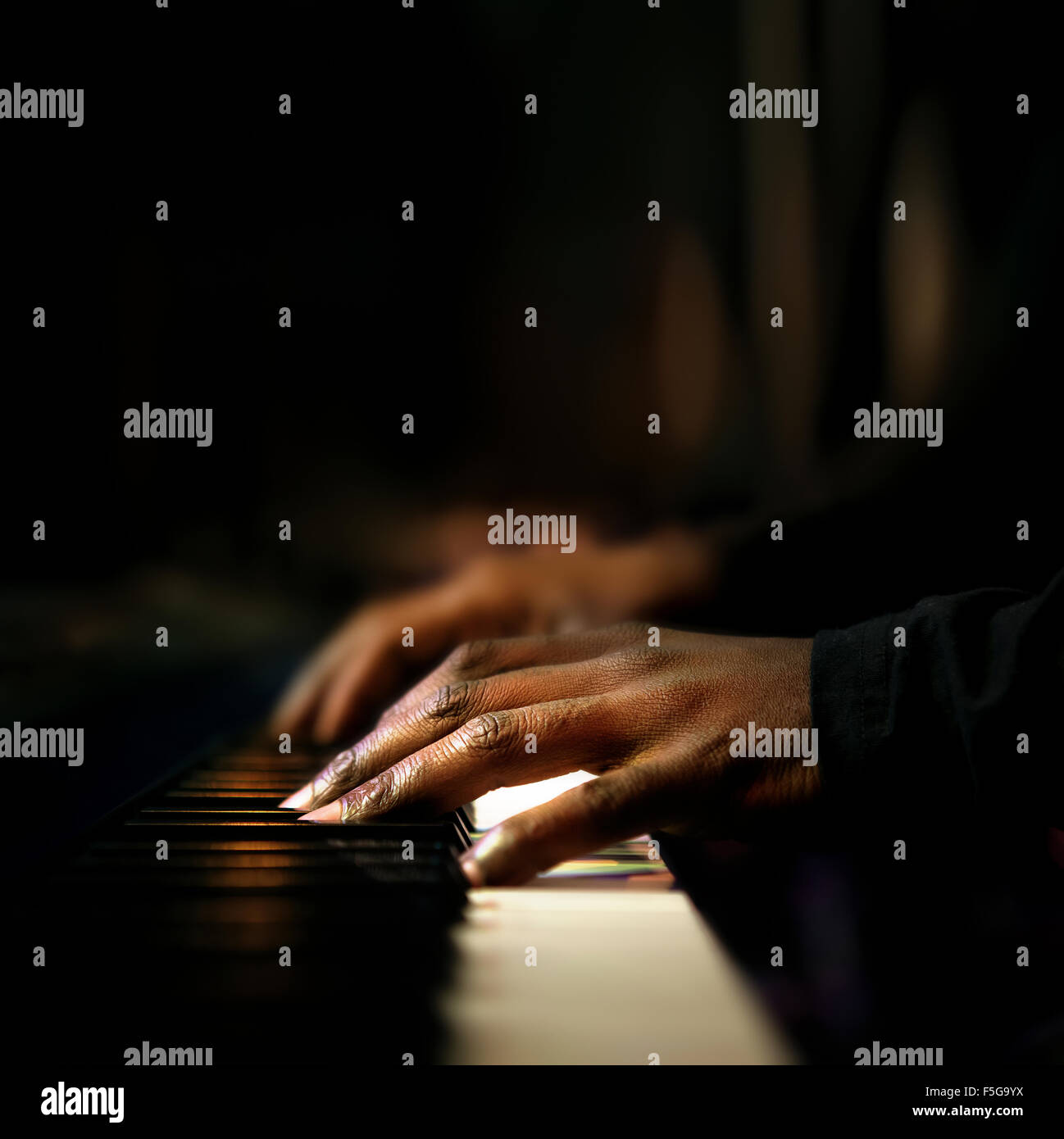 Hands of pianist playing synthesizer close-up Stock Photo