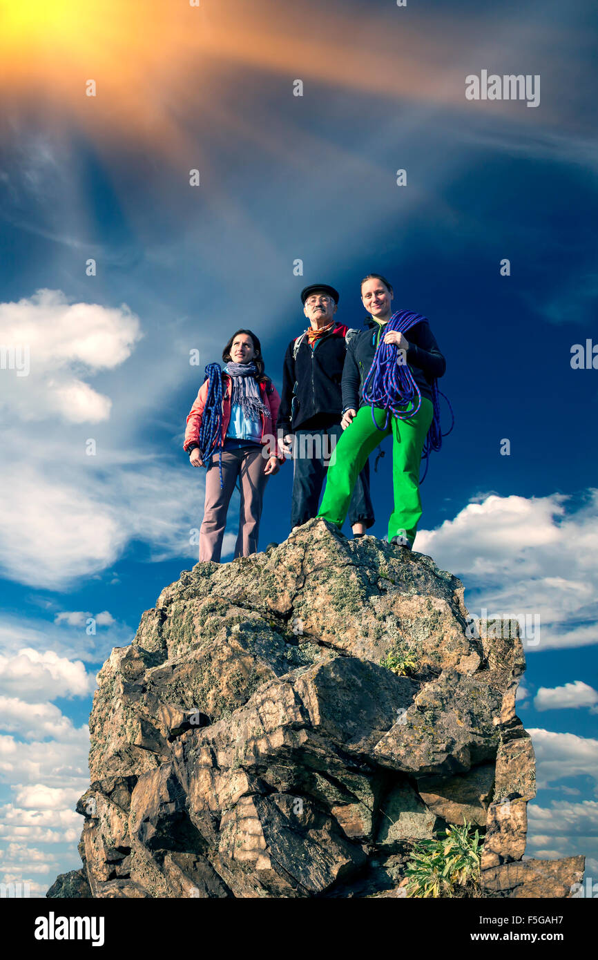 Group of climbers on sharp summit Stock Photo
