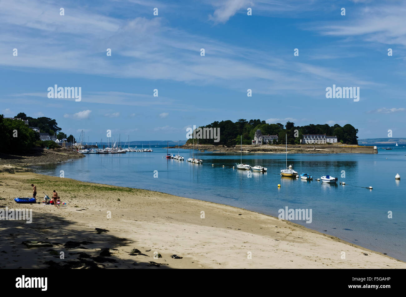harbour entrance moored boats and beach Douarnenez Brittany France Stock Photo