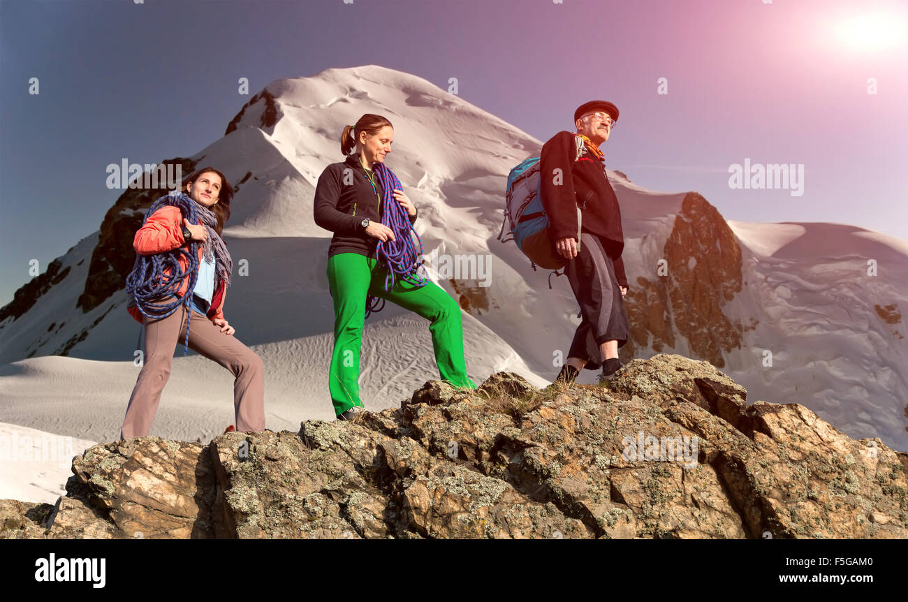 Group of climbers on alpine background Stock Photo