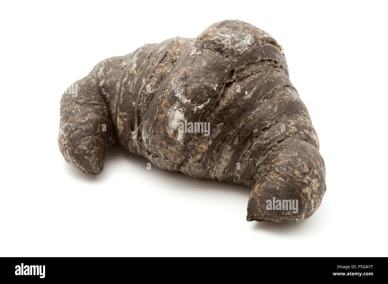 Black charcoal croissant on a white background Stock Photo
