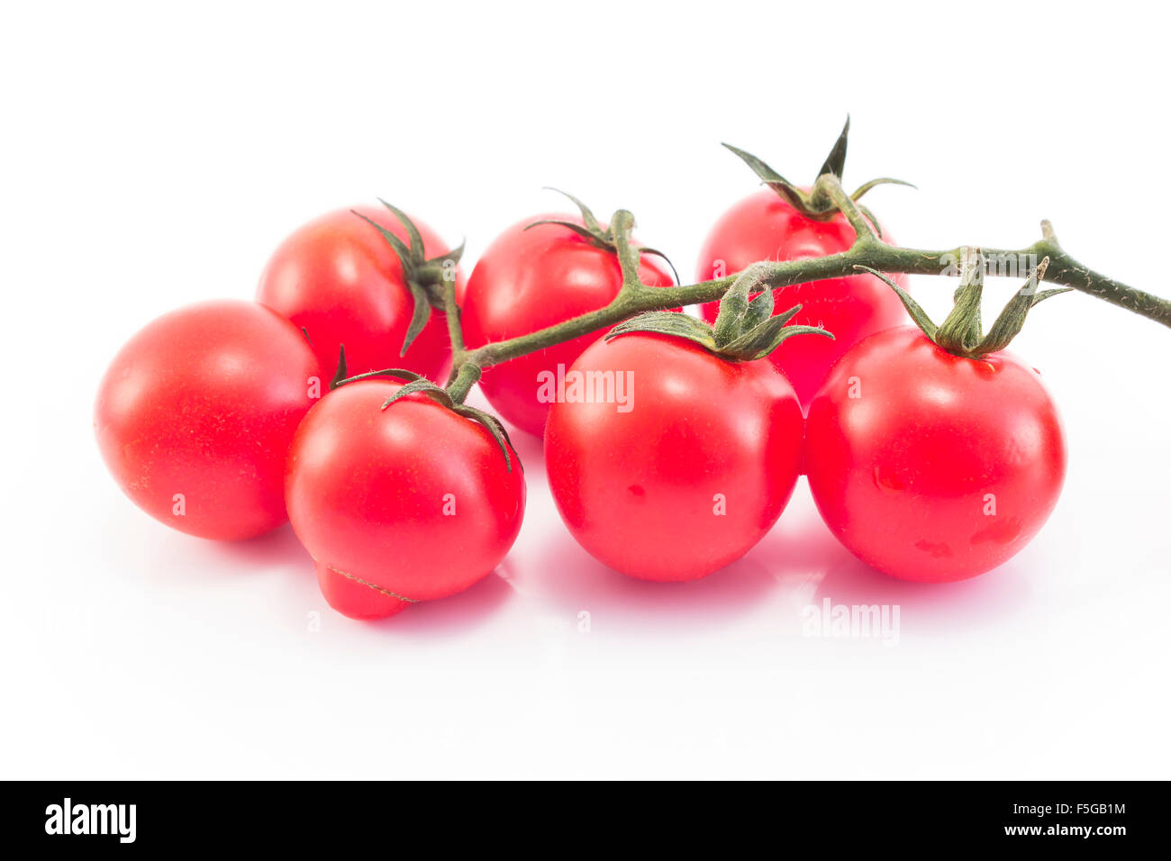 Cherry tomatoes isolated on white. Stock Photo
