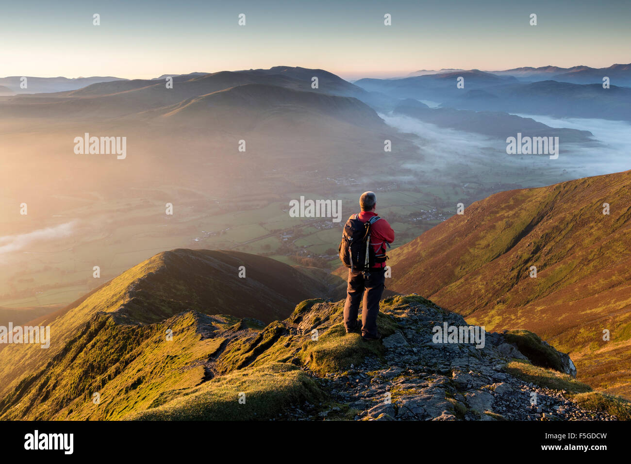 Walker Enjoying the View From the Top of Hall's Fell Ridge Blencathra, Lake District Cumbria UK Stock Photo
