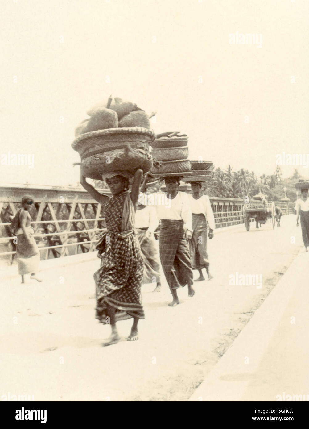 Carriers with packs on their heads , India Stock Photo