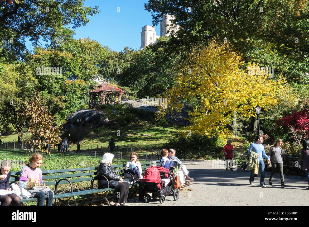 Park Visitors on Benches Near Wooden Gazebo in Central Park, NYC, USA Stock Photo Alamy