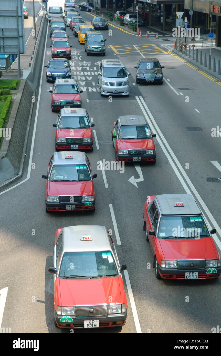 Taxis and traffic lined up on Harcourt Road, Hong Kong, Hong Kong Stock