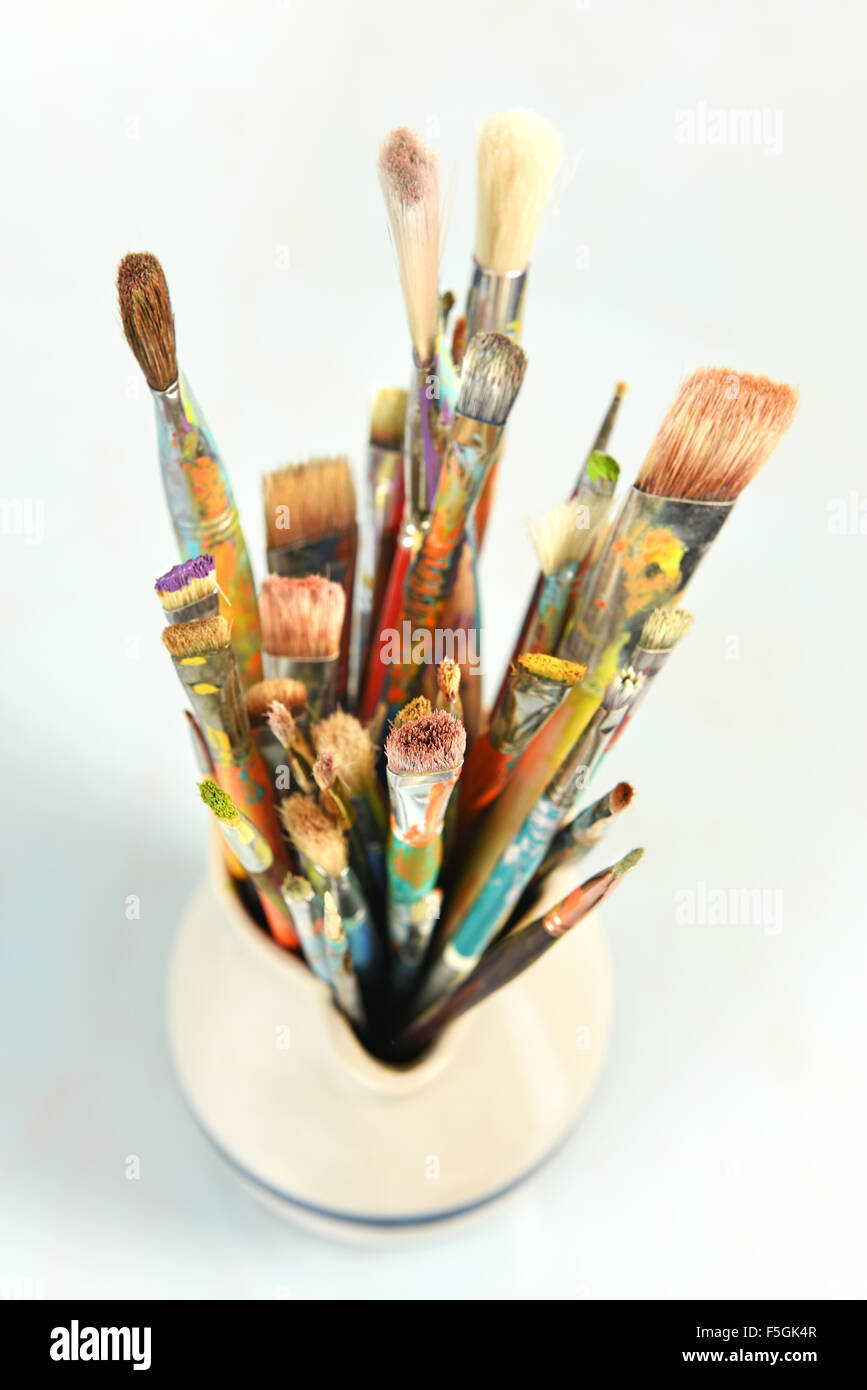 Artist paintbrushes over light background with shallow depth of field Stock Photo