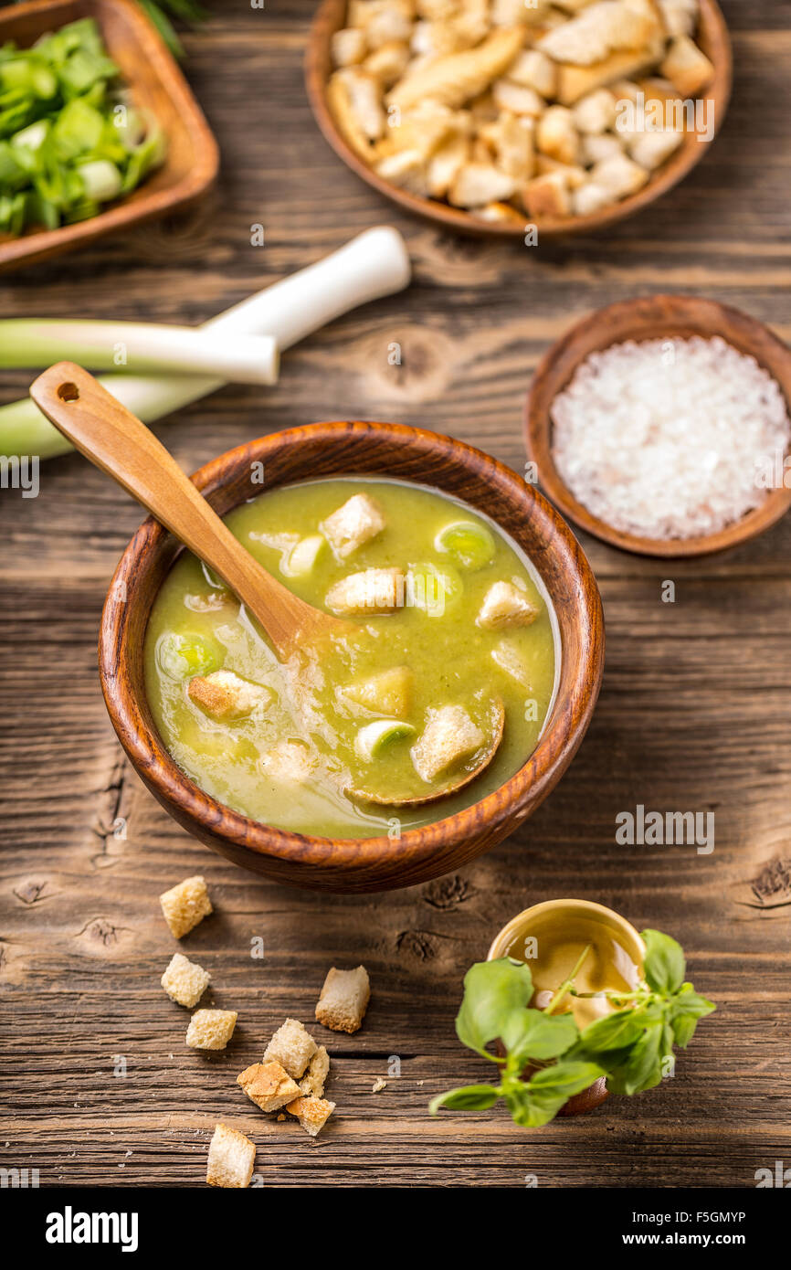 A bowl of leek and potato soup with bread croutons Stock Photo