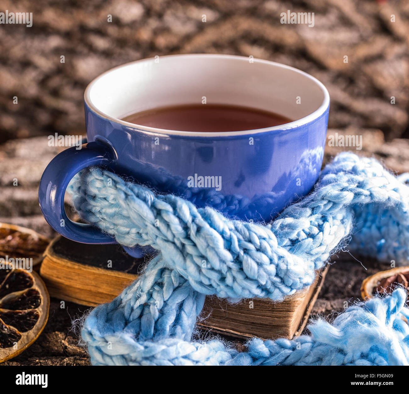 Cup of tea wrapped in blue scarf Stock Photo Alamy