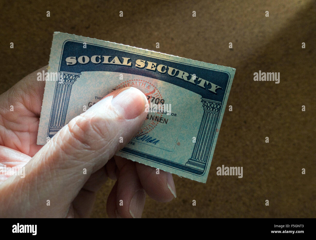 man holding social security card Stock Photo