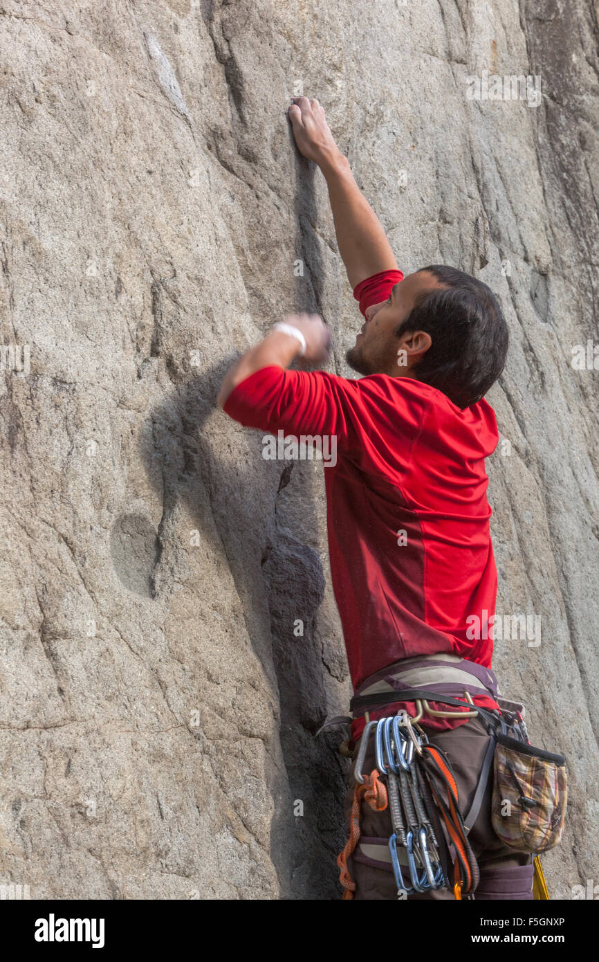 Man, Climber climbing up the rock face, Czech Republic Stock Photo