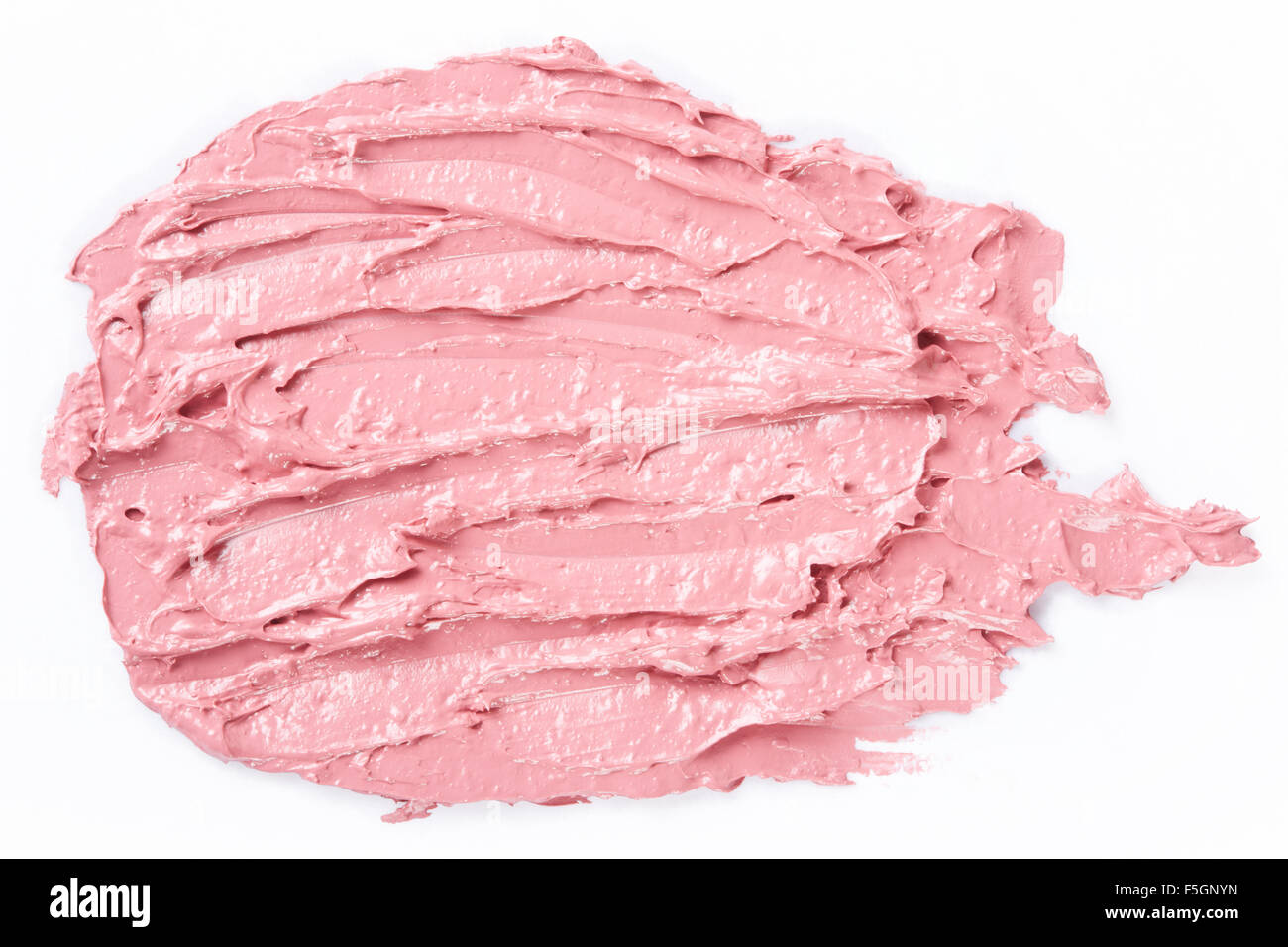 Smudged lipstick pink stroke on white Stock Photo
