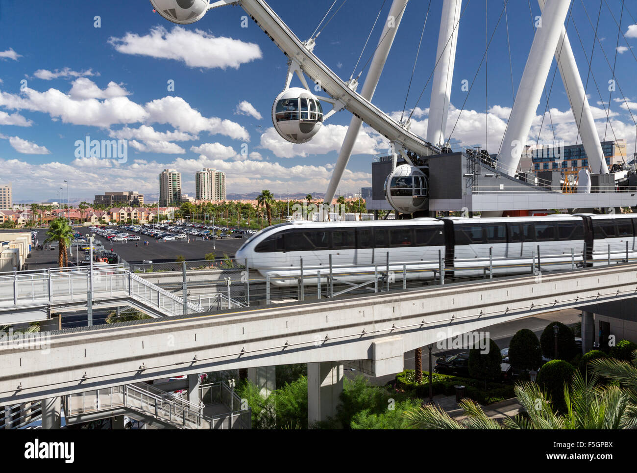 Las Vegas, Nevada.  Monorail Speeds by  High Roller in background, world's tallest observation wheel, as of 2015. Stock Photo