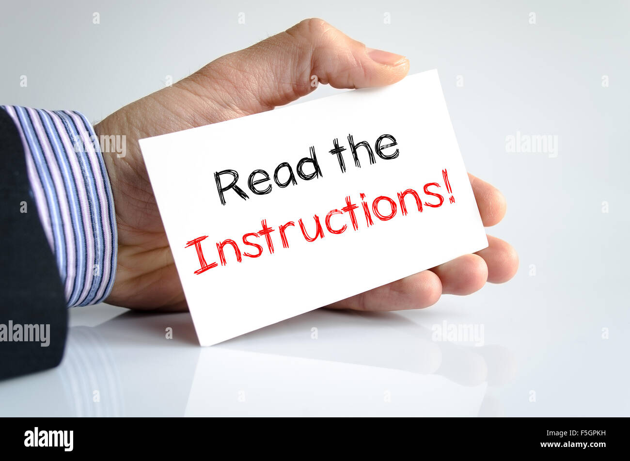 Read the instructions text concept isolated over white background Stock Photo