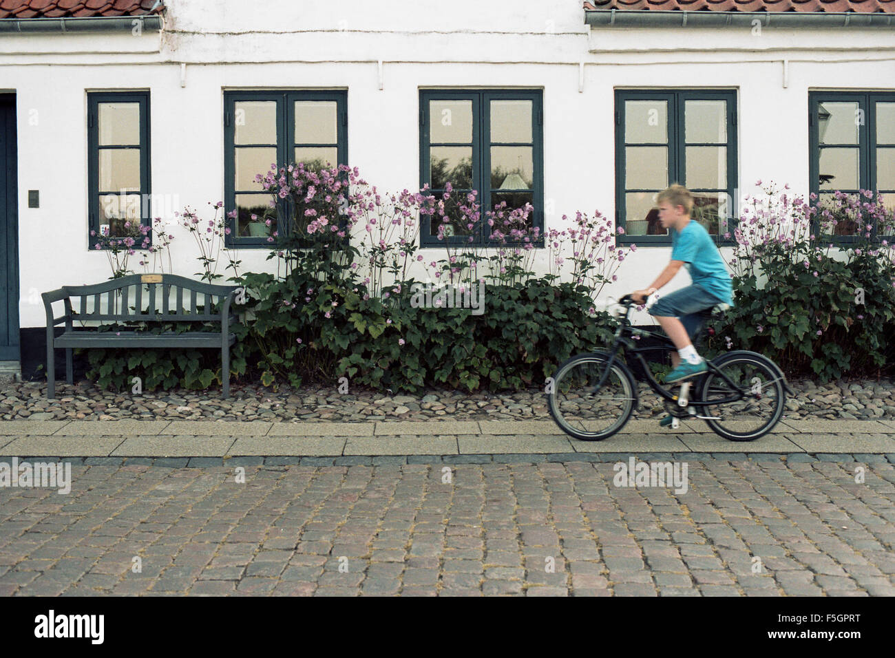 Boy riding a bike in Ribe, Denmark Stock Photo - Alamy