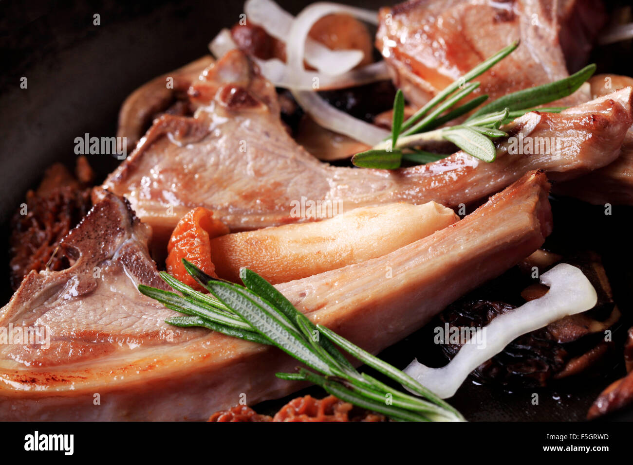 Roast lamb chops and mushrooms on a pan Stock Photo - Alamy