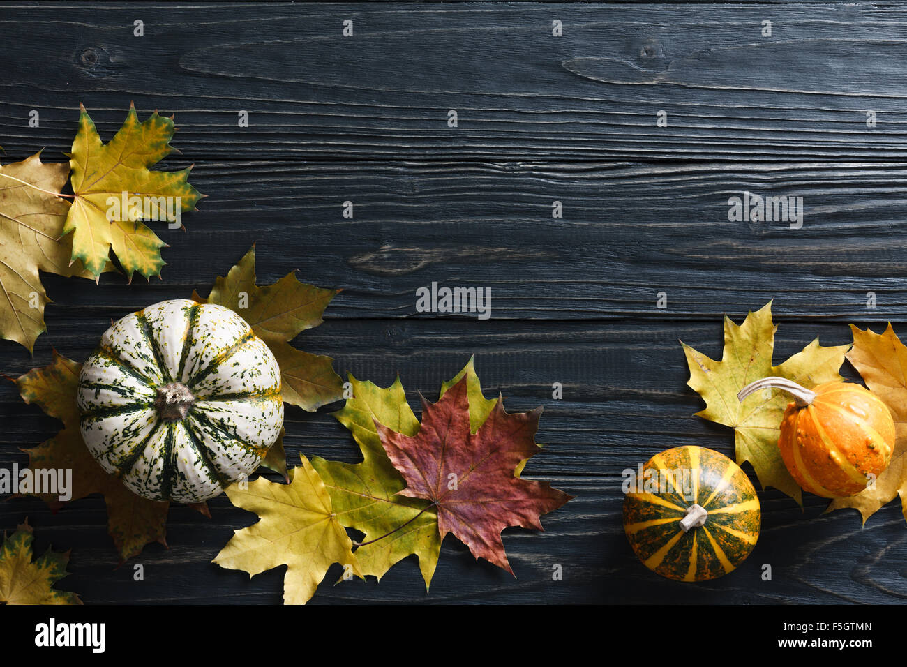 Autumn background with pumpkins and leaves Stock Photo - Alamy