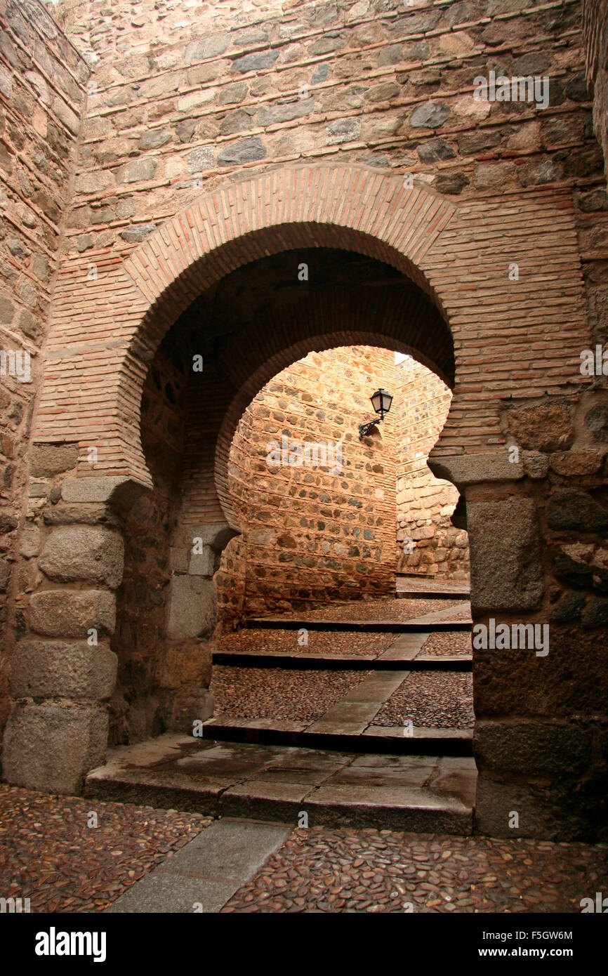 Horseshoe arch inside Toledo old town, Spain Stock Photo