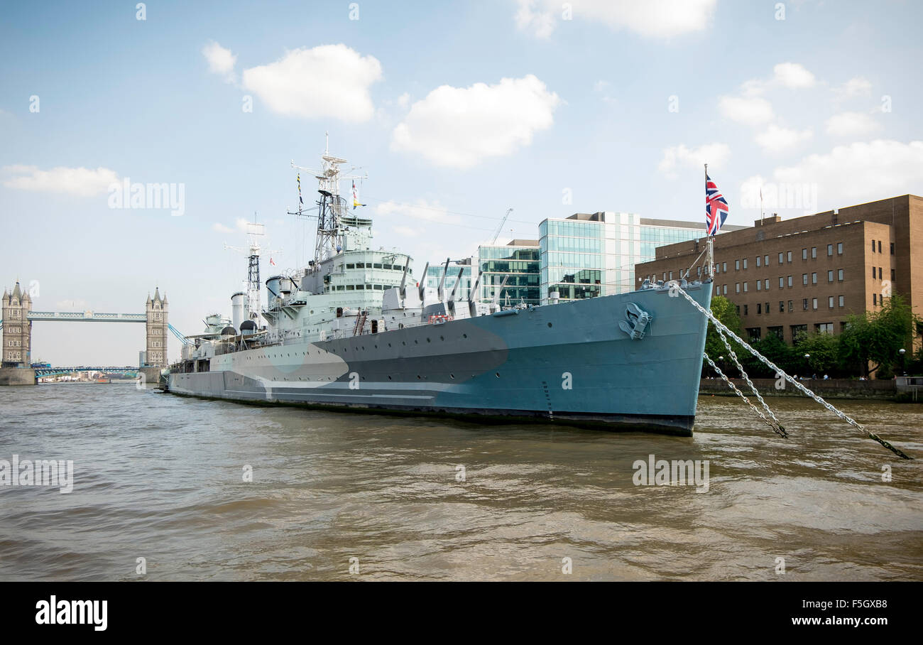 HMS Belfast on the Thames in London. One of the first ships to open fire on D-Day 1945. Now a major tourist attraction. Stock Photo