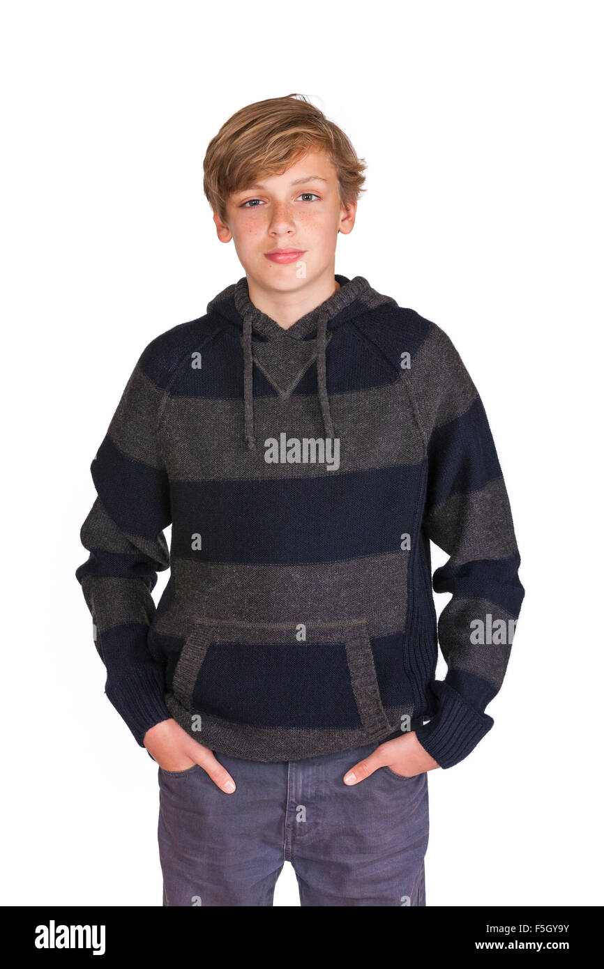 White background studio photograph of a standing male teenage blond boy child wearing a hoody Stock Photo