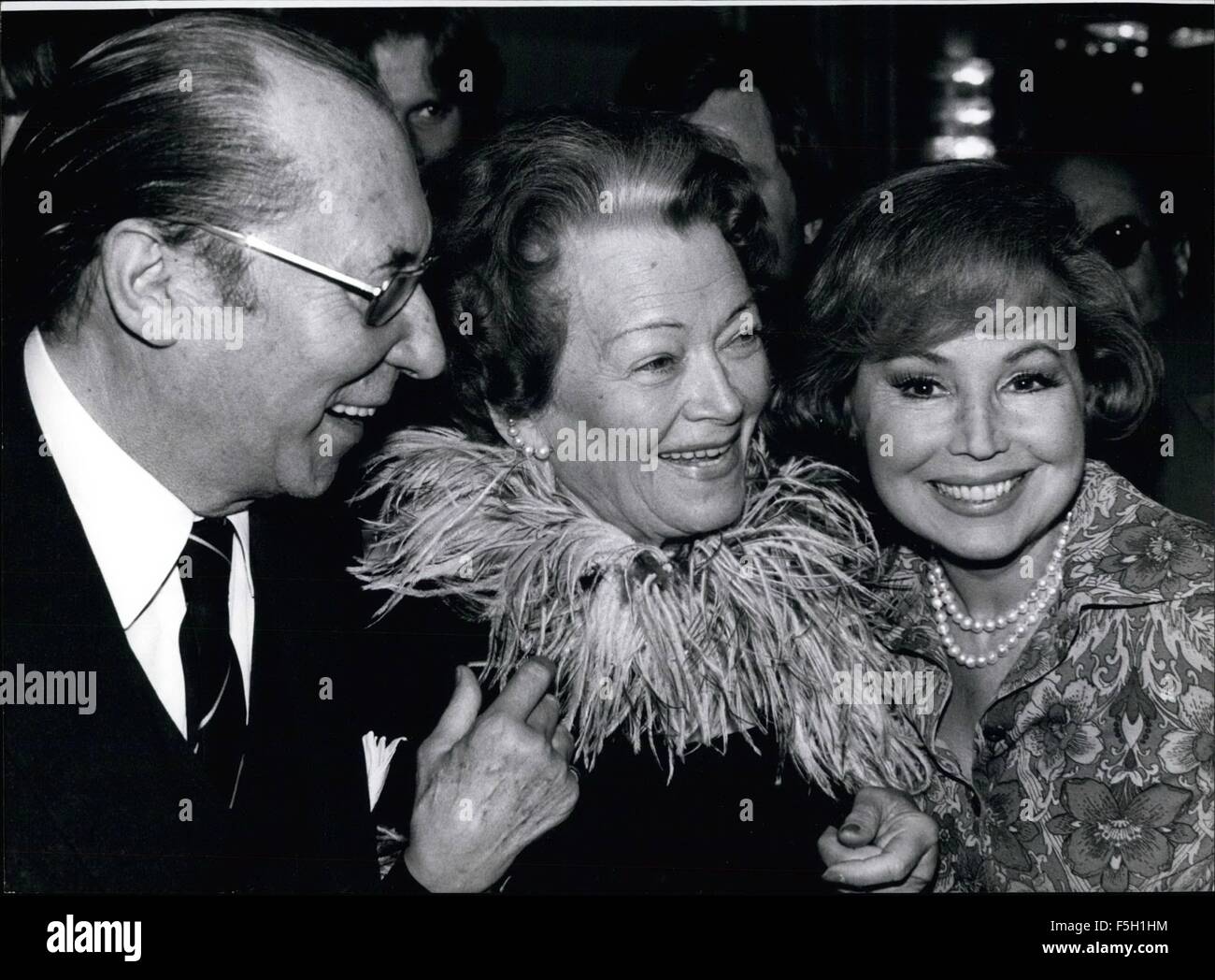 1977 - Olga Tschechowa German actress and now successful owner of factory for cosmetics celebrated her 80th birthday (April 26, 1977) in a Munich Hotel. 400 personages from film, show business, politics and industry wished her many happy returns of the day. OPS:- Carl Raddartz (L), actor and partner of Olga Tschechowa in a lot of films, and famous German singer Annelise Rothenberger (R) congratulating the person celebrating her birthday (middle) © Keystone Pictures USA/ZUMAPRESS.com/Alamy Live News Stock Photo