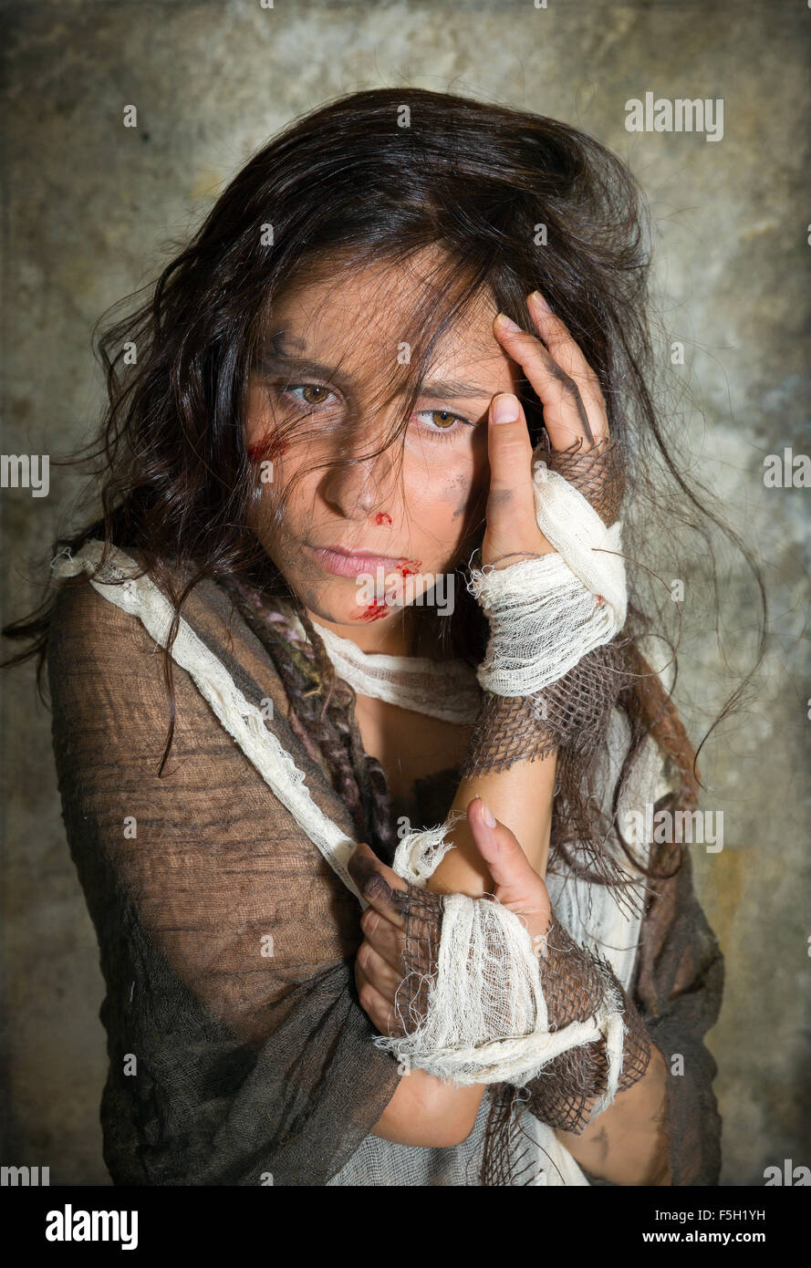 Homeless young woman dressed in rags in a derelict building Stock Photo 89499861 Alamy