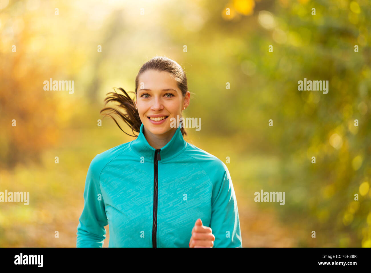 Female fitness model training outside and running Stock Photo Alamy