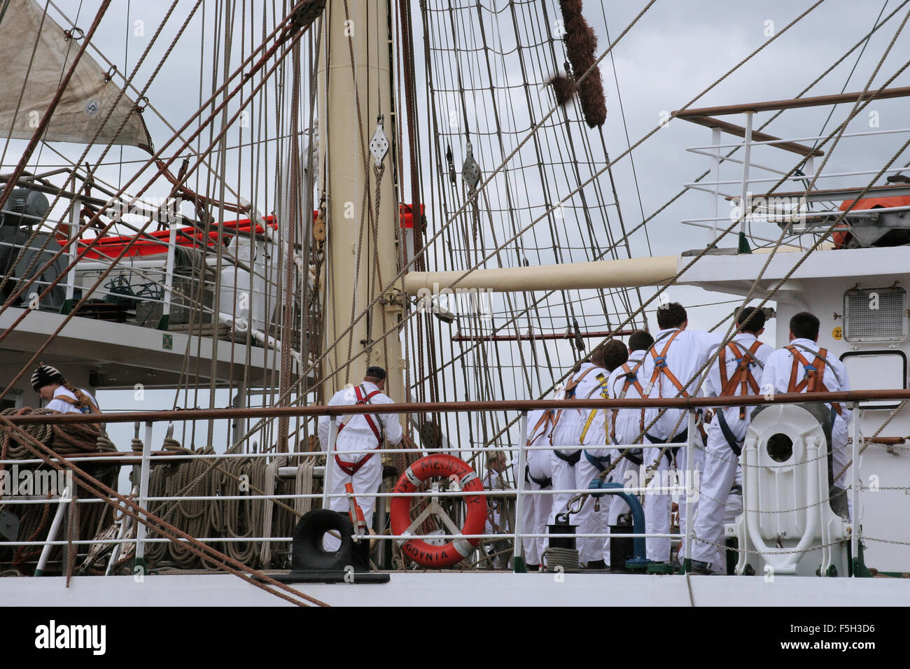 Hoisting sails of the ship "Dar Mlodziezy", Gdynia, Poland Stock Photo