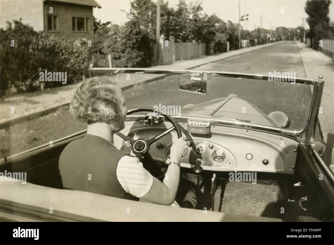 A woman driving a Pontiac convertible car, Denmark Stock Photo