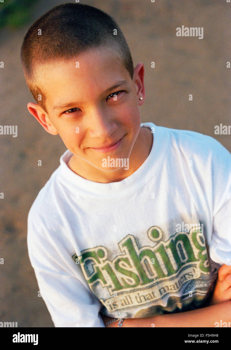 Portrait of young boy looking at camera Stock Photo - Alamy