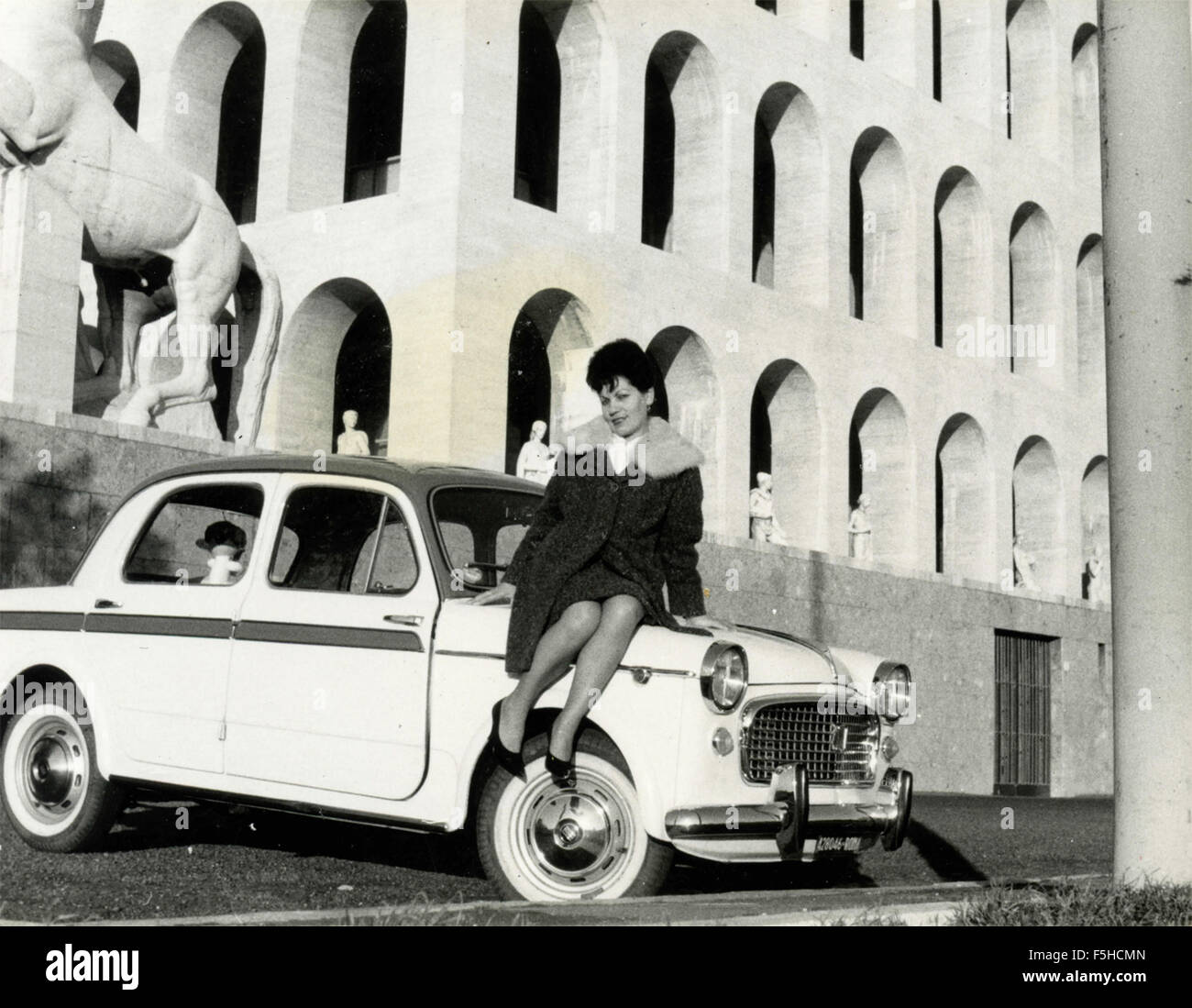 A woman sitting on a car FIAT bicolor 1100, Rome, Italy Stock Photo - Alamy