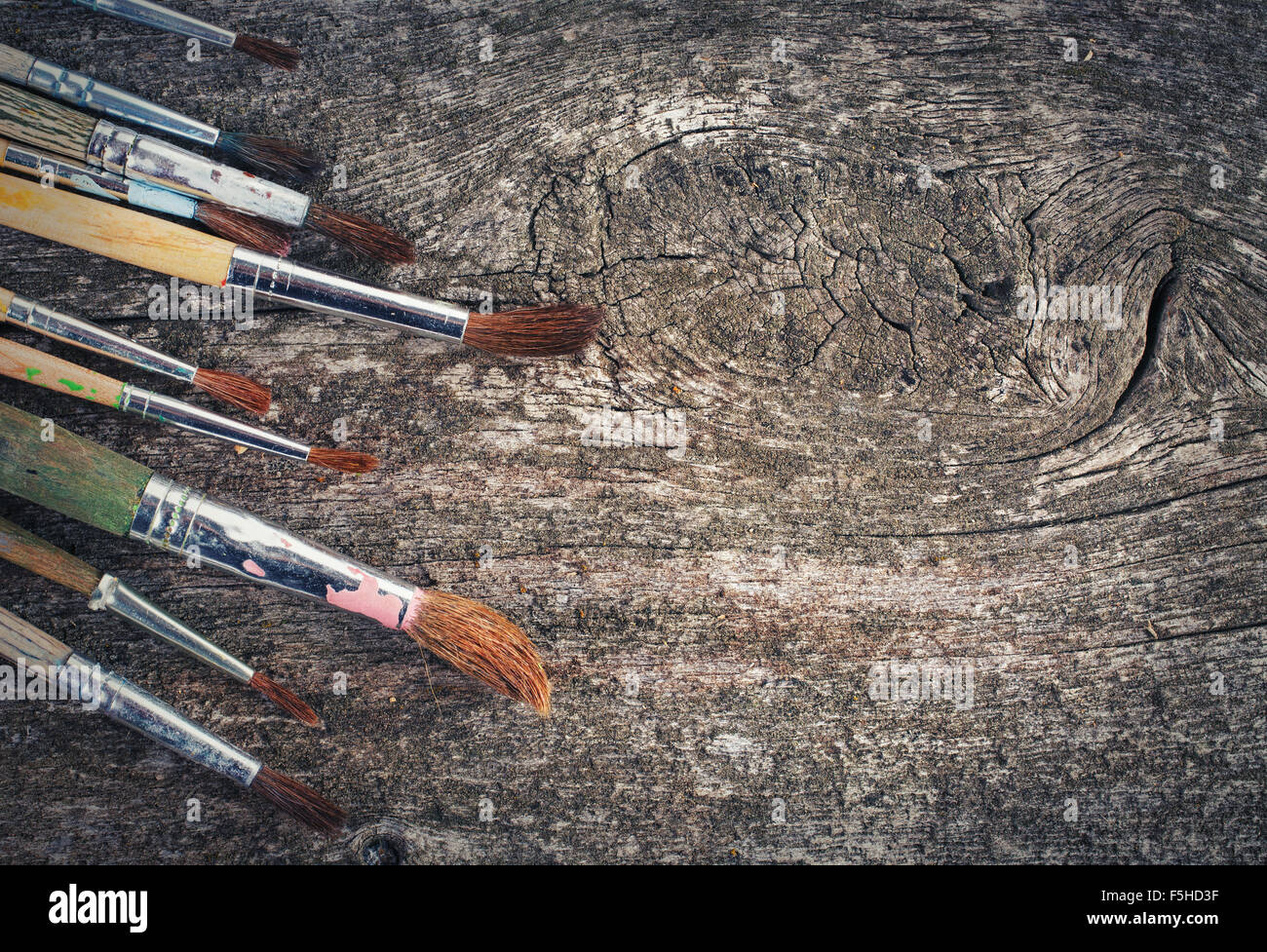 brushes for painting on wooden background Stock Photo - Alamy