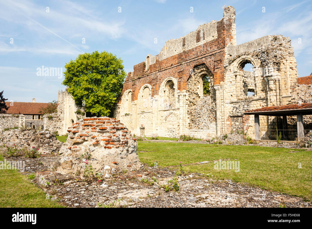 England, Canterbury. St Augustines Abbey. Remains of the Norman north wall of the nave of the Abbey Church with blue sky background Stock Photo