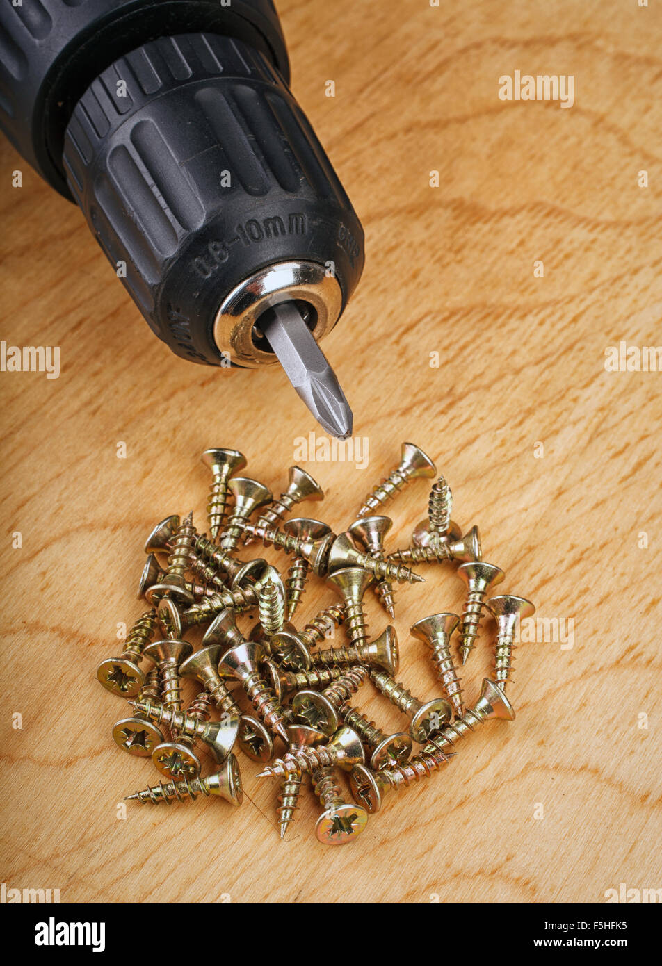 Electric drill and screws Stock Photo