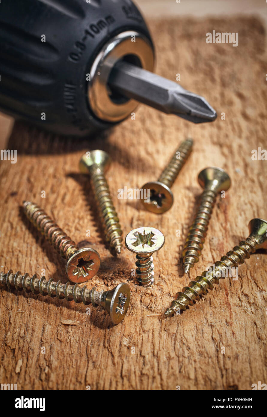 Electric drill and screws Stock Photo
