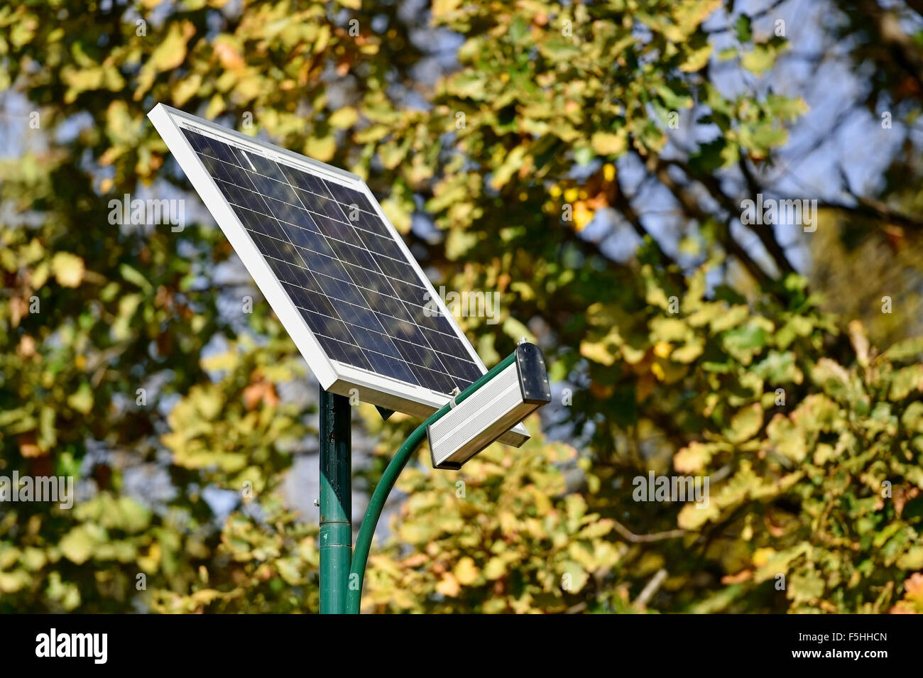 Solar street lamp in a park isolated on a clear blue sky Stock Photo