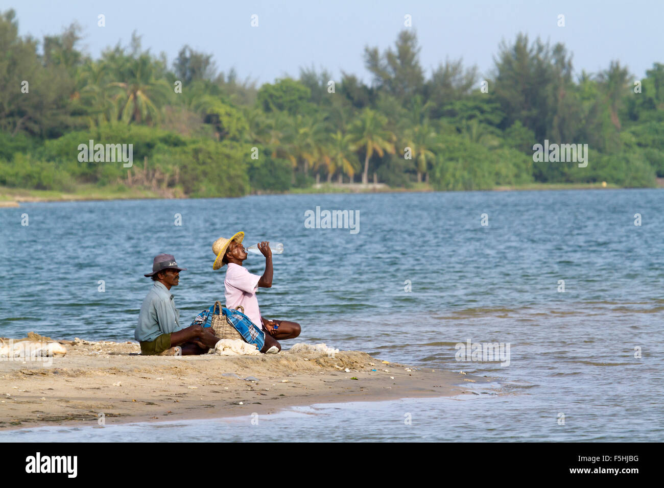 Traditional fishermen resting after fishing in Batticaloa, Sri Lanka Stock Photo