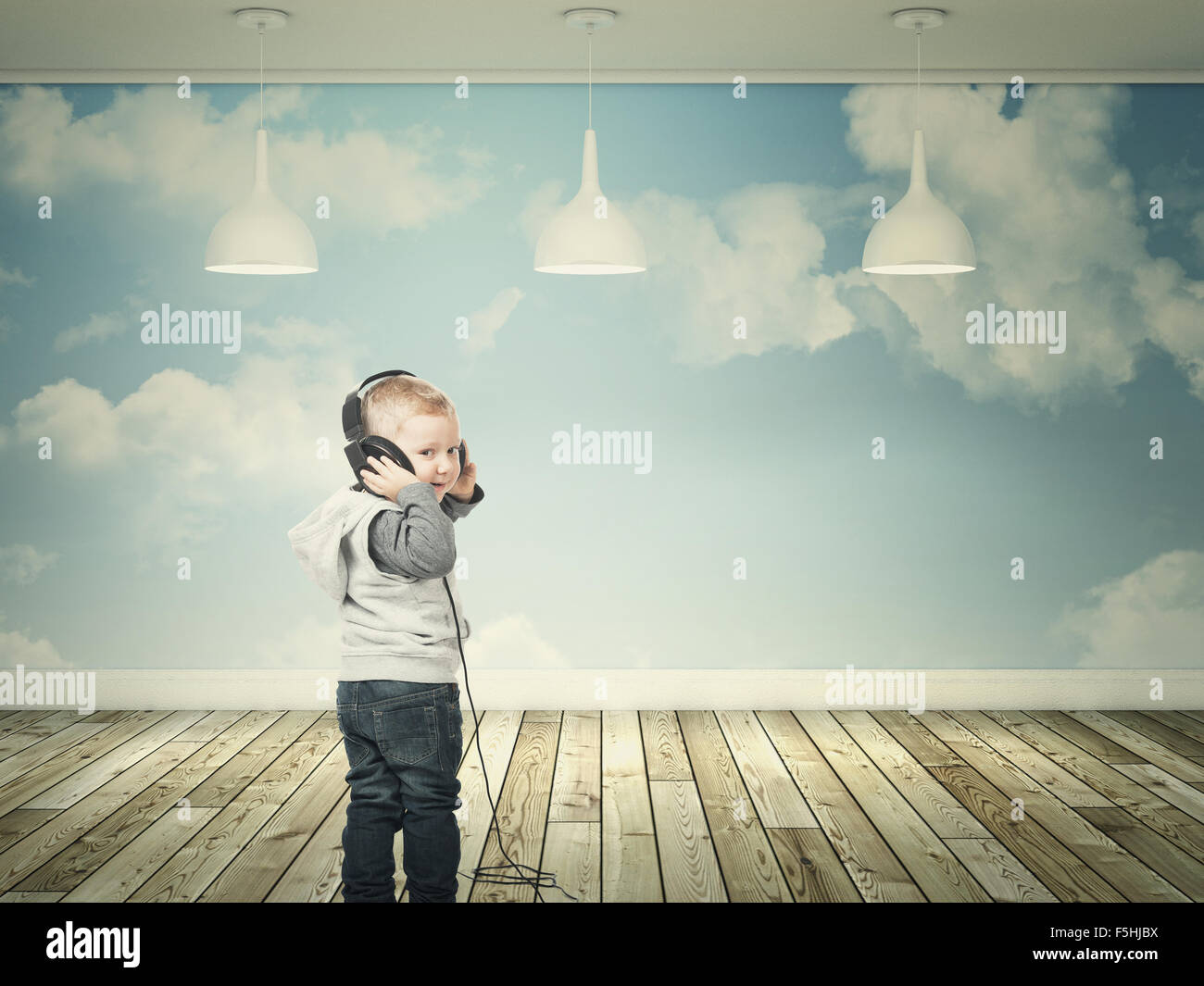 smiling kid with headphone and 3d interior Stock Photo