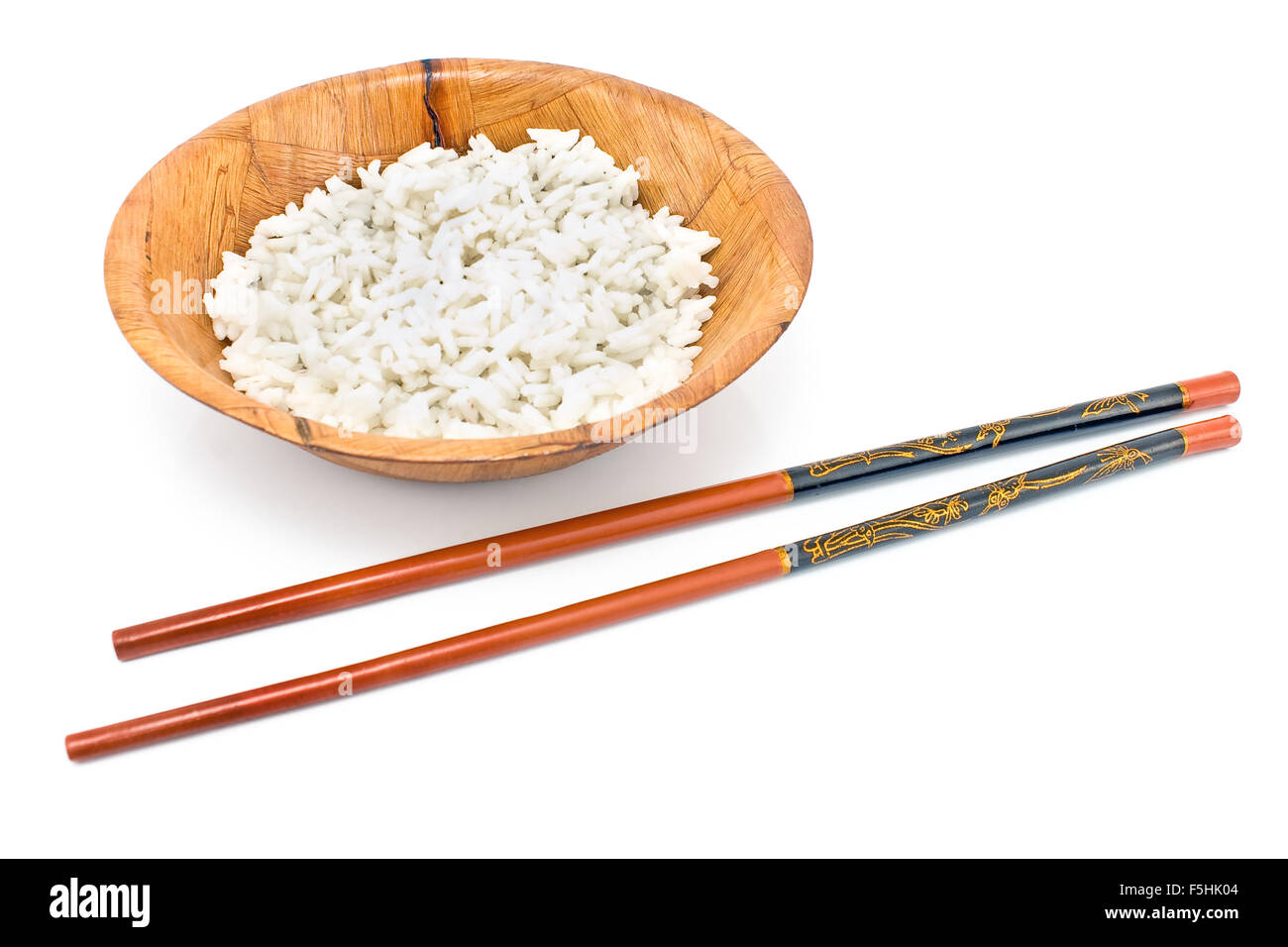 Bamboo bowl with rice and chopsticks isolated on white Stock Photo